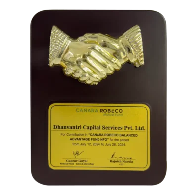Dhanvantri Capital Services Pvt Ltd received an award from Canara Robeco Mutual Fund AMC for outstanding performance in NFO contribution.