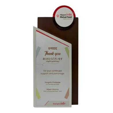 Dhanvantri Capital Services Pvt Ltd received an award from Nippon India Mutual Fund AMC for outstanding performance in financial services.